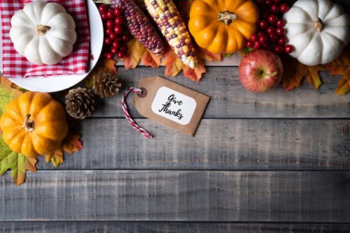 wooden table with fresh pumpkin and fresh corn